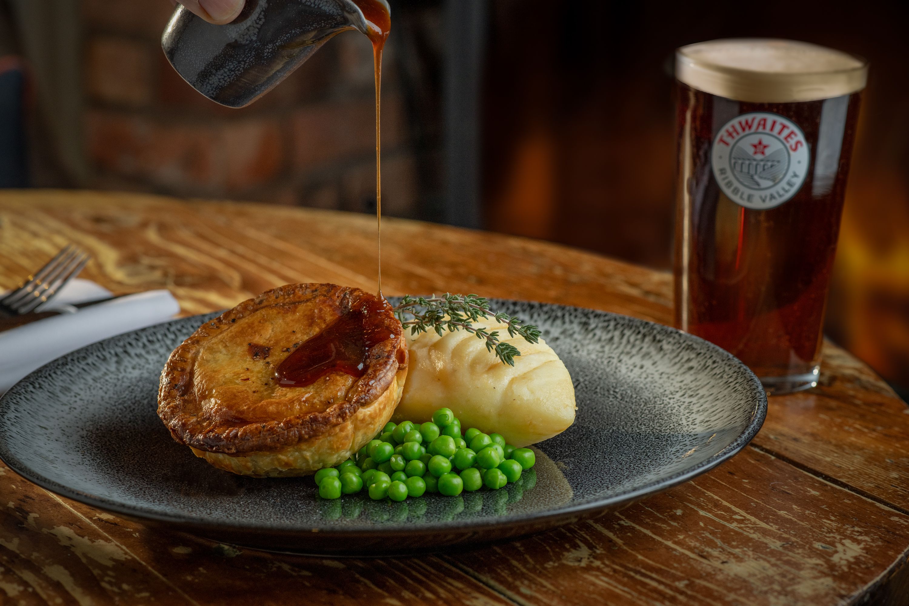 pie mash and peas with a pint of thwaites