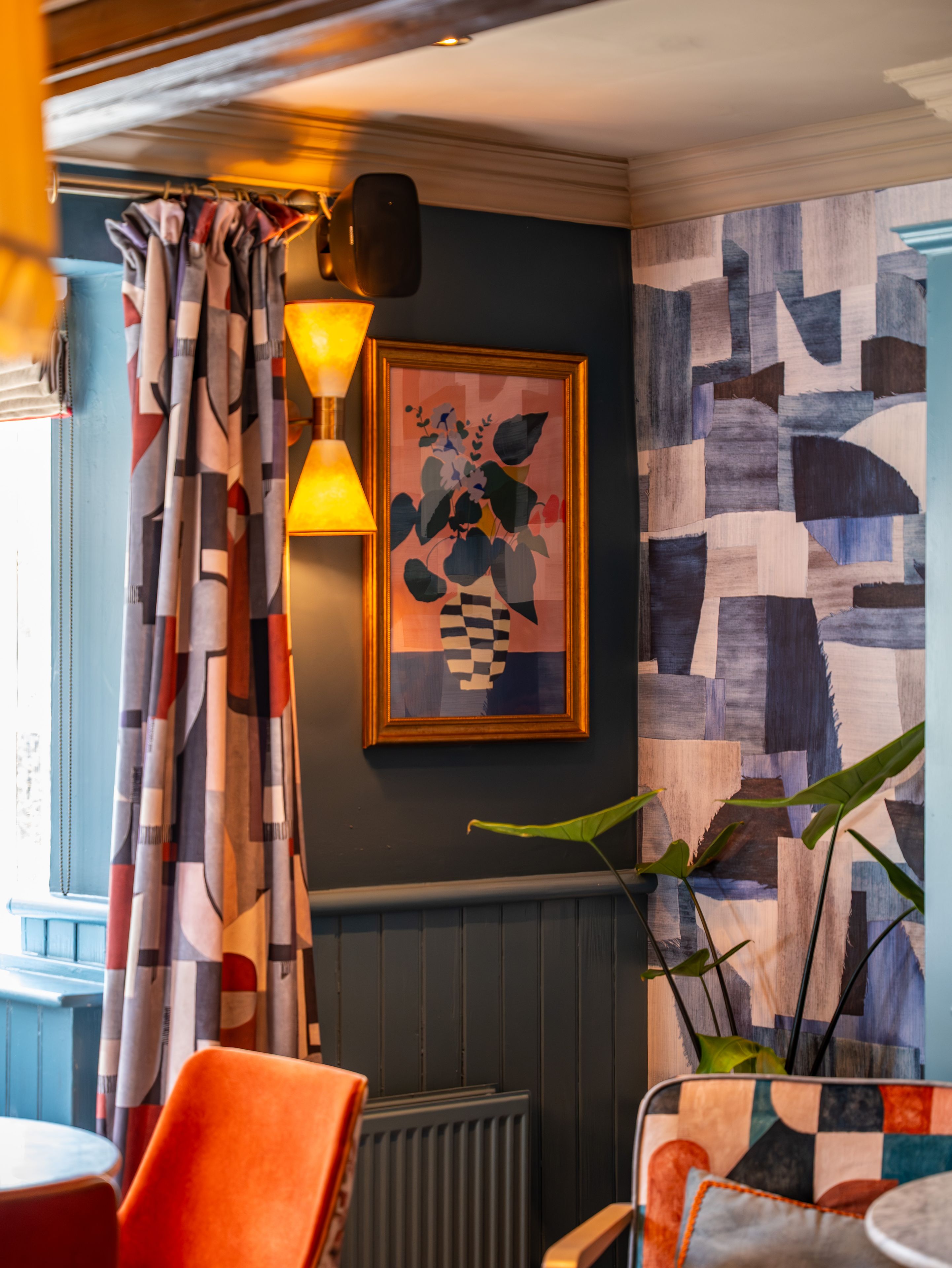 artwork in the corner of the bar